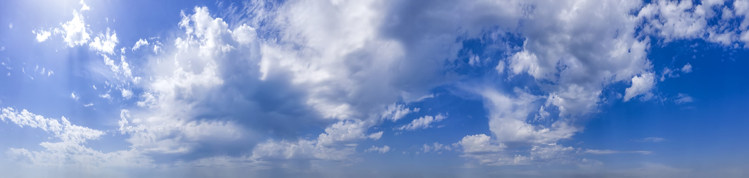 Panoramic view of blue sky with clouds.